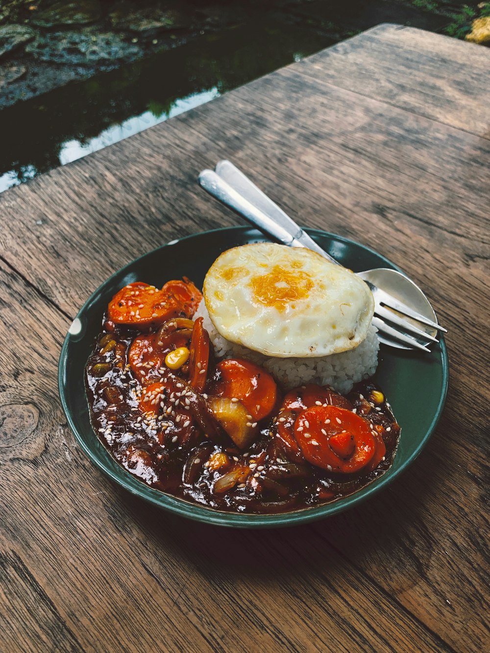 a plate of food on a wooden table