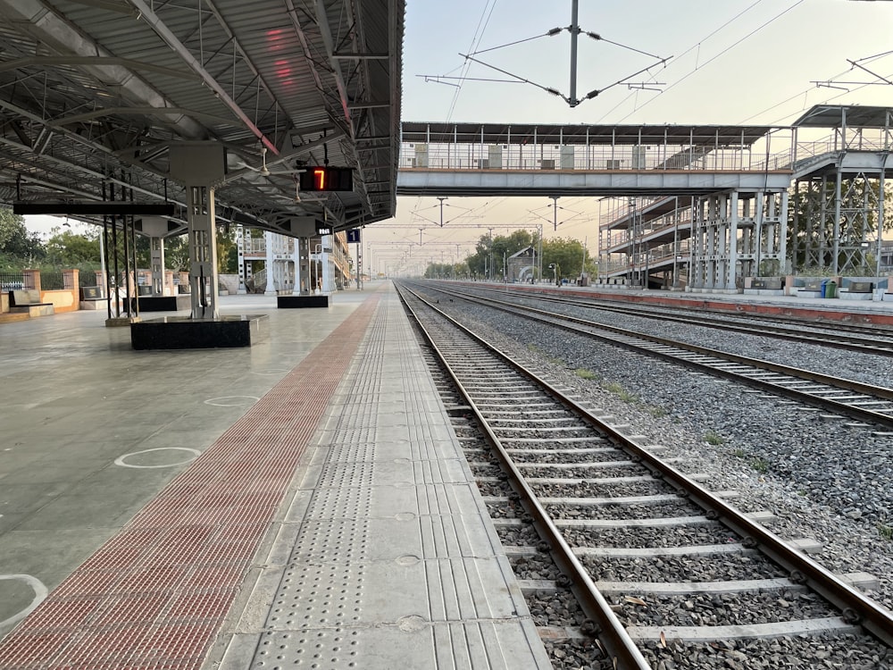 a train station with a train on the tracks