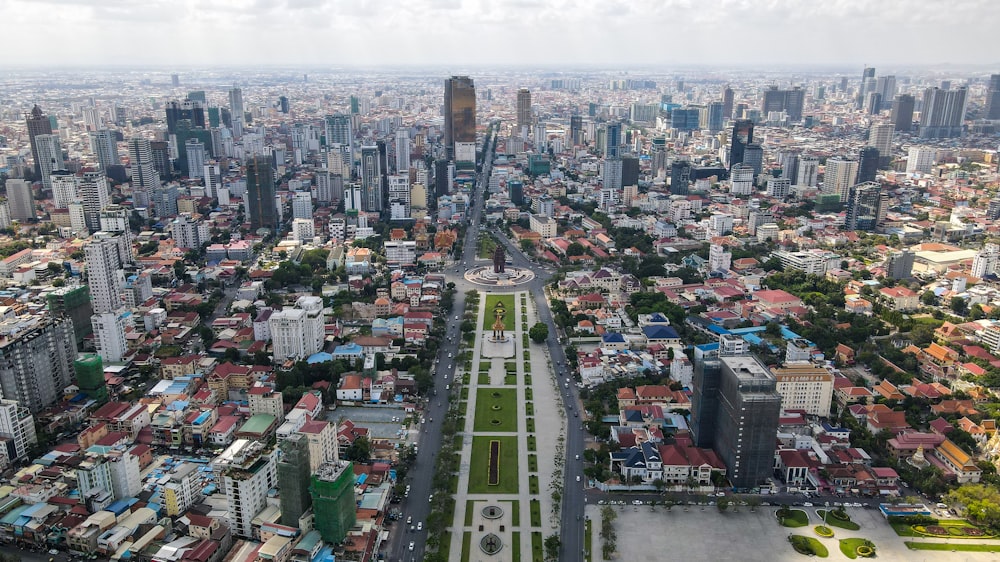 an aerial view of a city with tall buildings