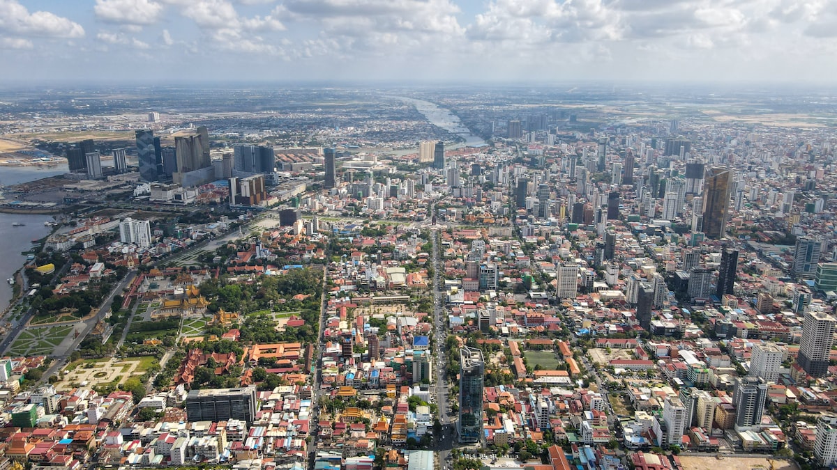 Phnom Penh July — the city in wet season with the Mekong swollen and overcast skies over the capital