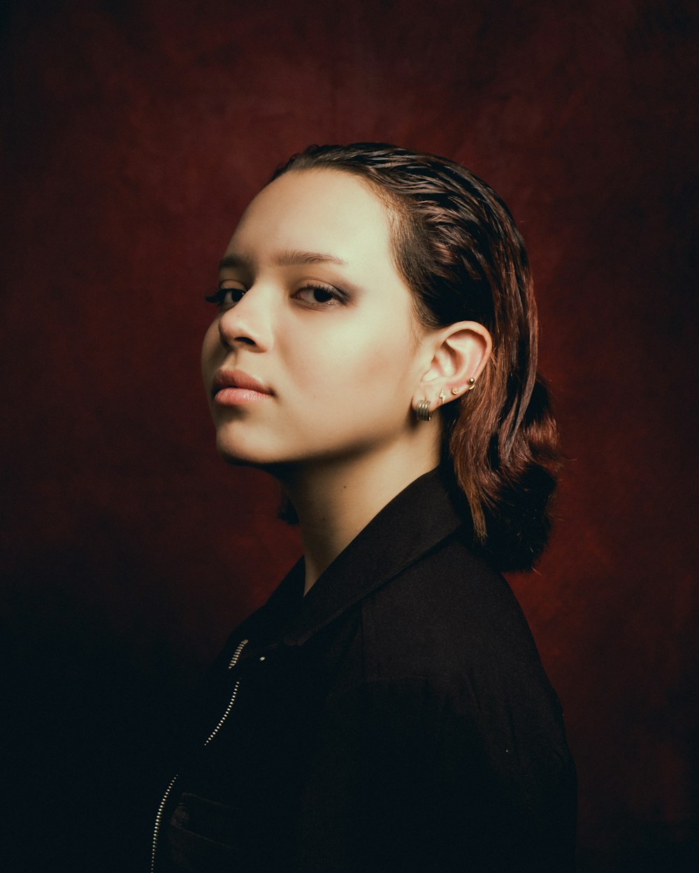 a woman in a black shirt is posing for a picture