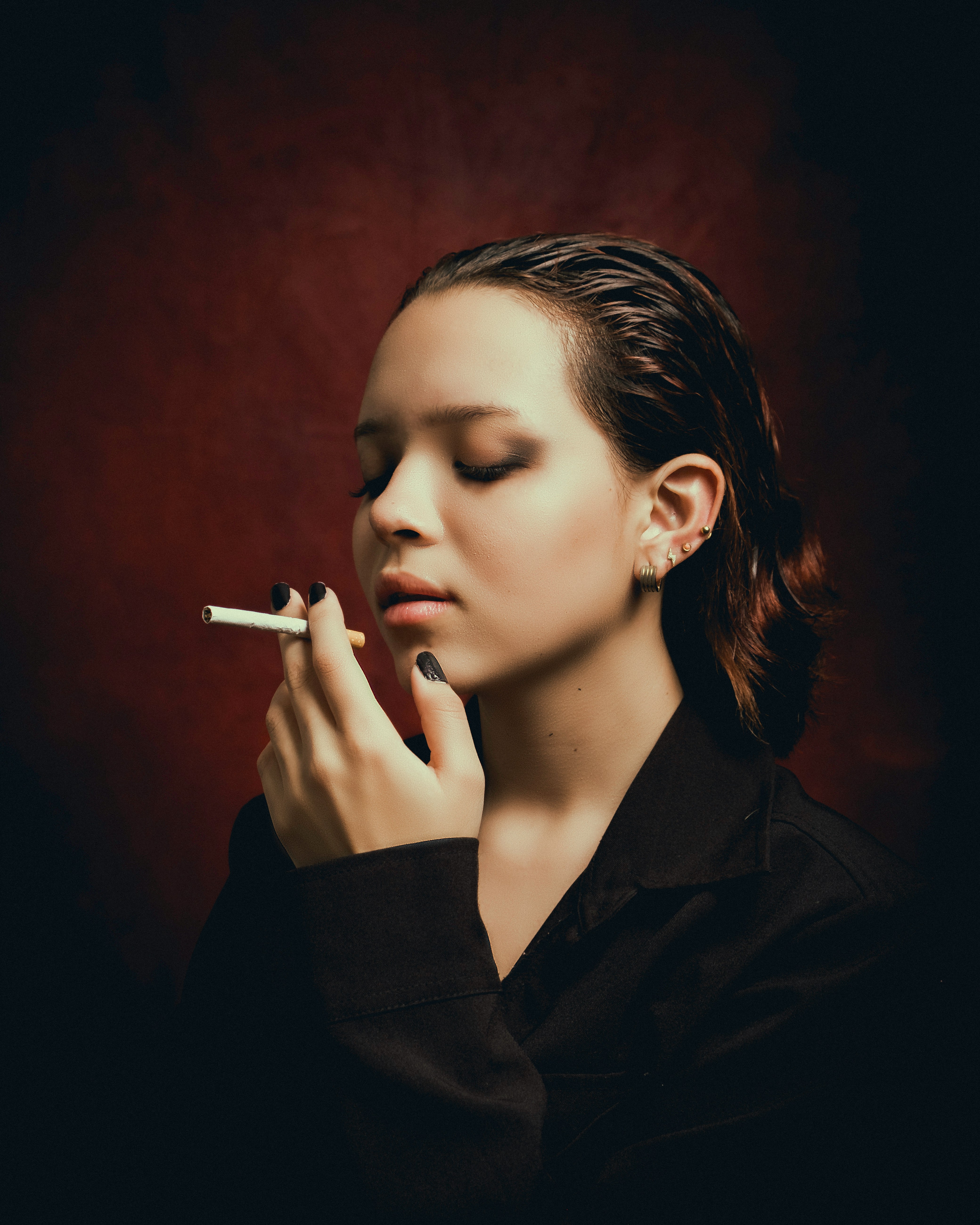 Image of a person using nicotine strips as part of a quit-smoking plan