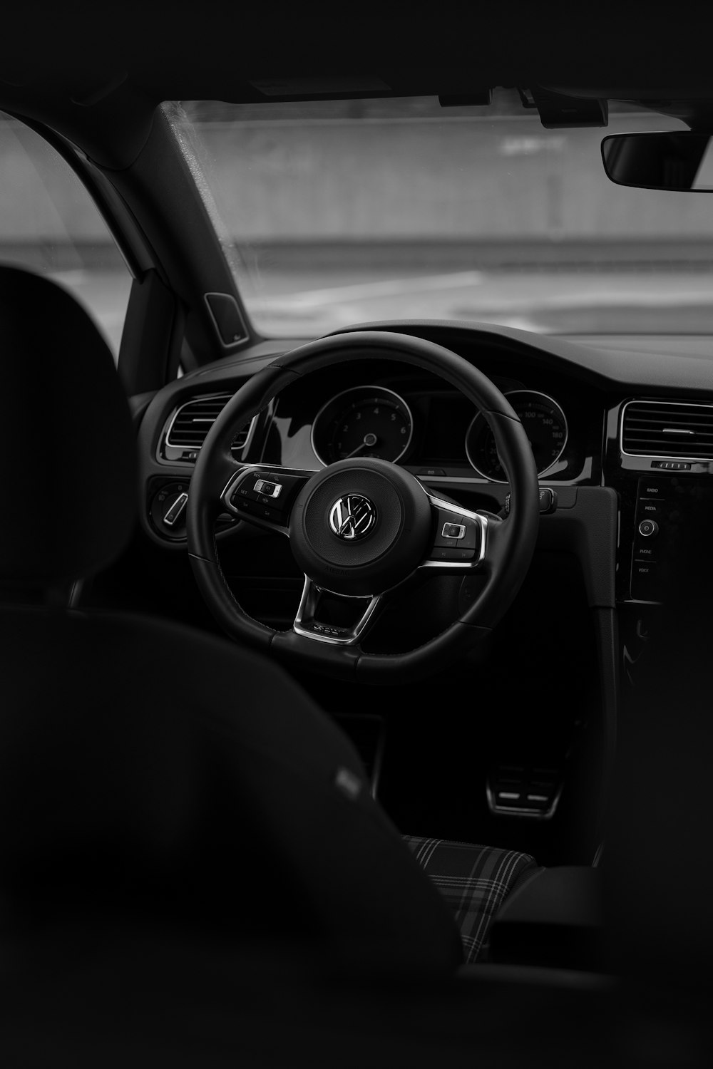 a black and white photo of the interior of a car