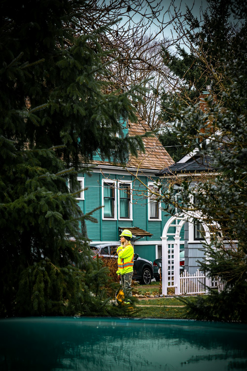 a fireman standing in front of a blue house