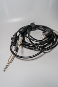 A close-up of various audio cables and connectors neatly arranged on a table.