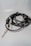 Close-up of high-quality audio cables arranged neatly on a wooden surface.
