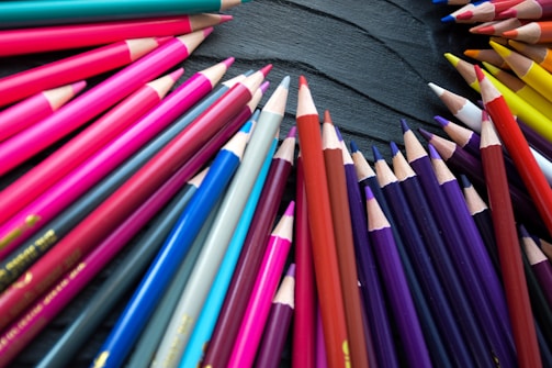 An image showing a variety of stylish pencil cases arranged on a bright surface.