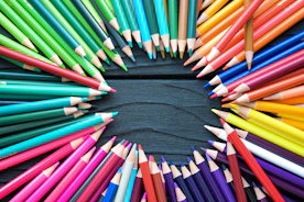 a group of colored pencils arranged in a circle