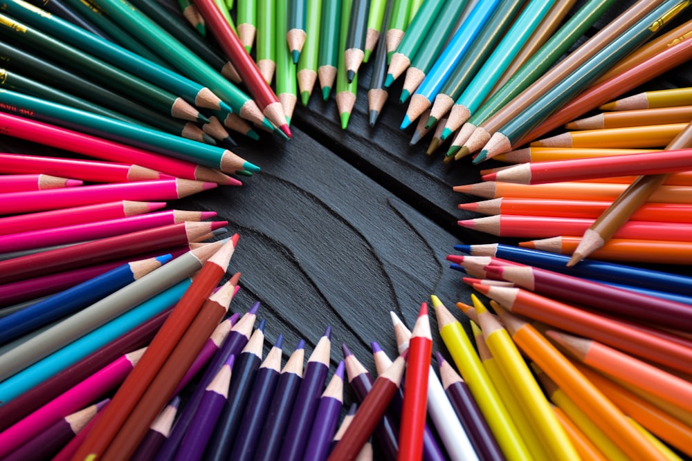 a circle of colored pencils arranged in a circle