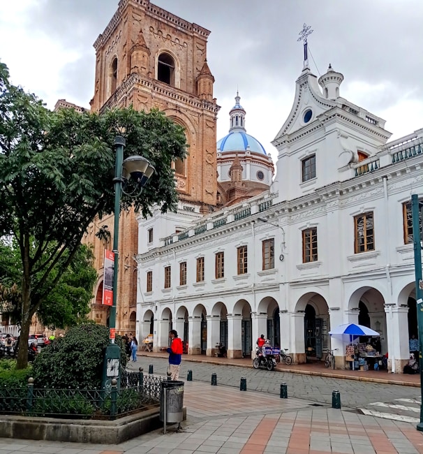 a large white building with a clock tower