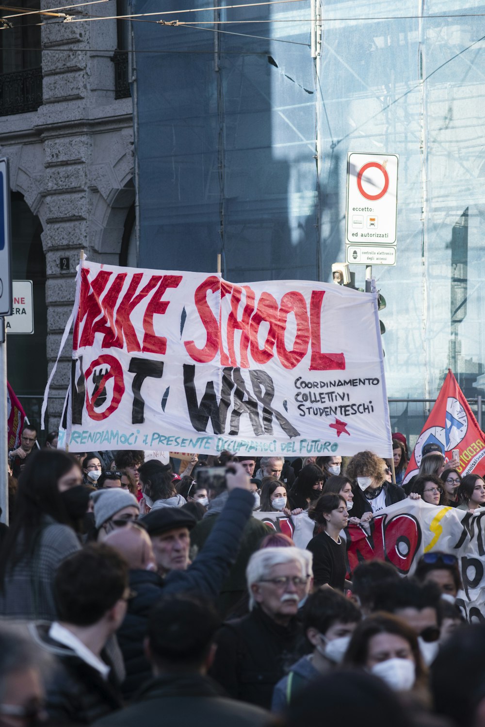 a large group of people holding up signs