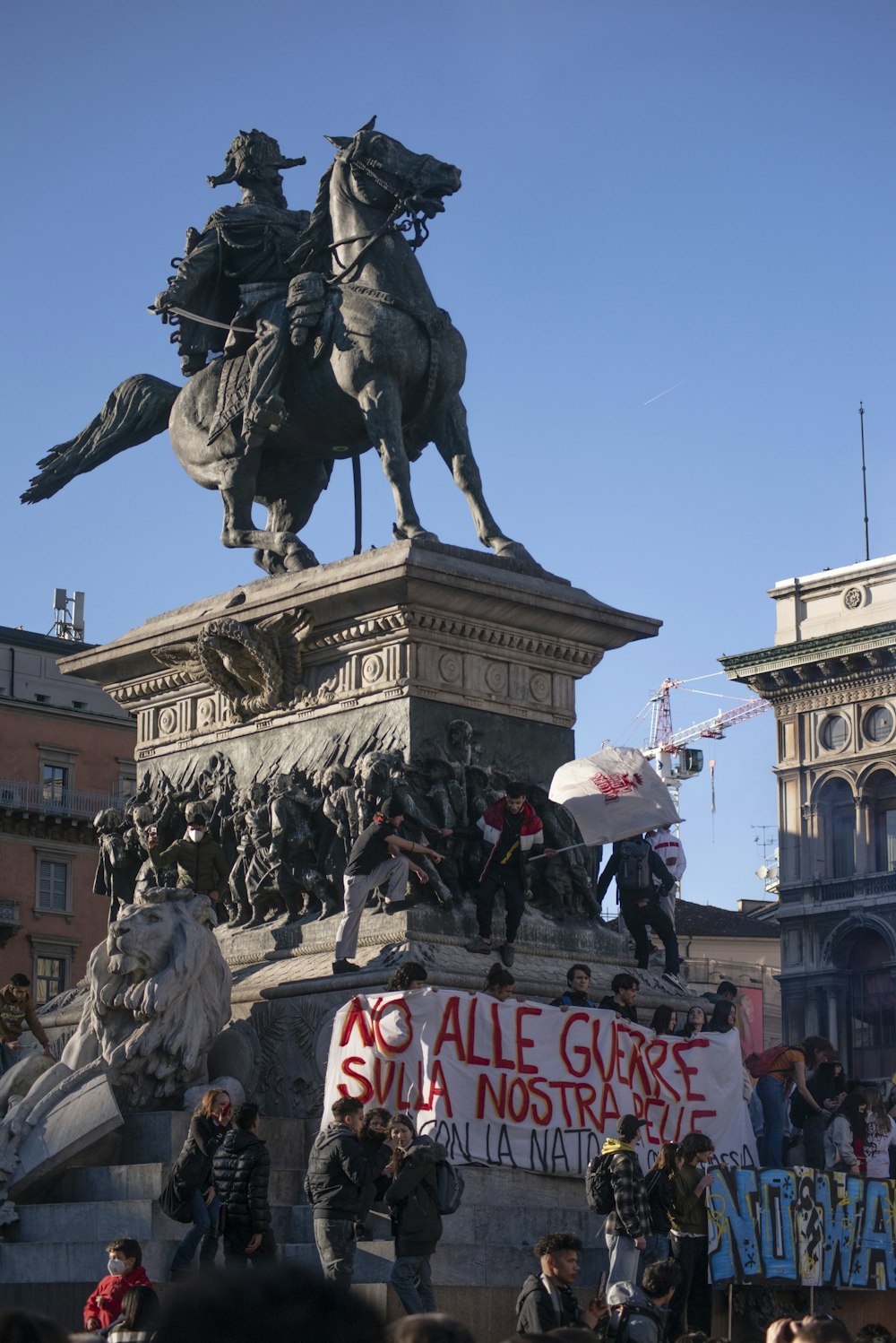 a crowd of people standing around a statue