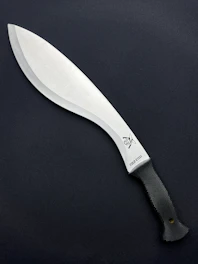 a large knife with a black handle on a black surface
