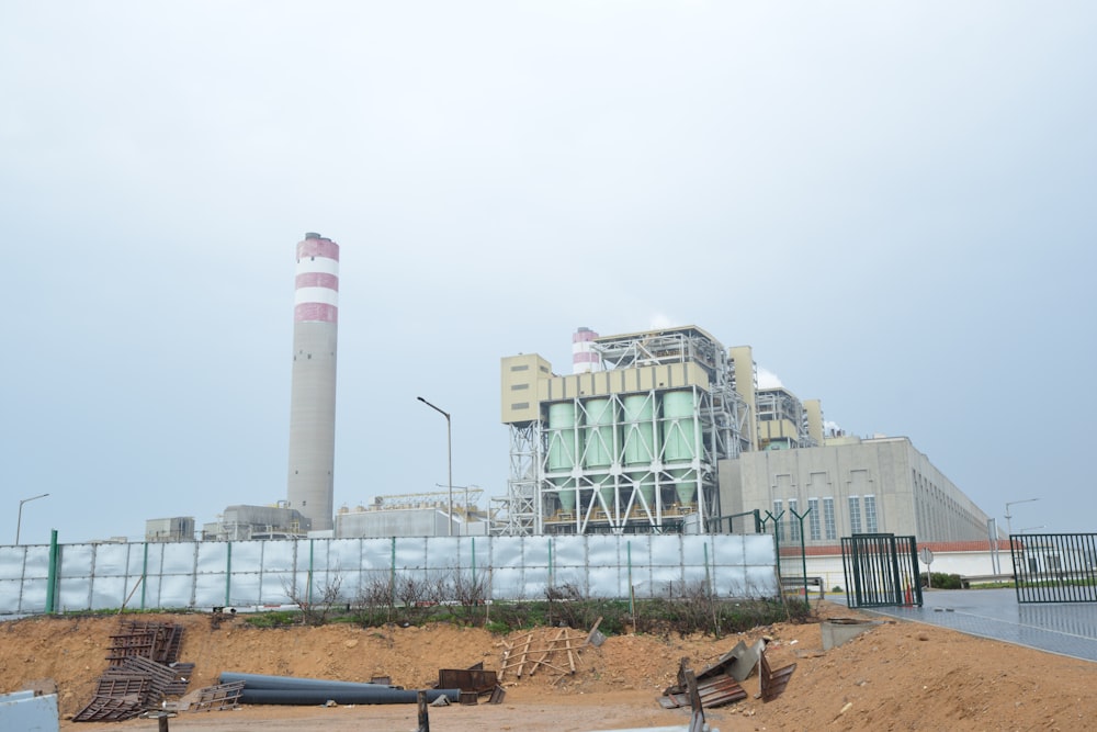 a factory building with a large pipe sticking out of it's side