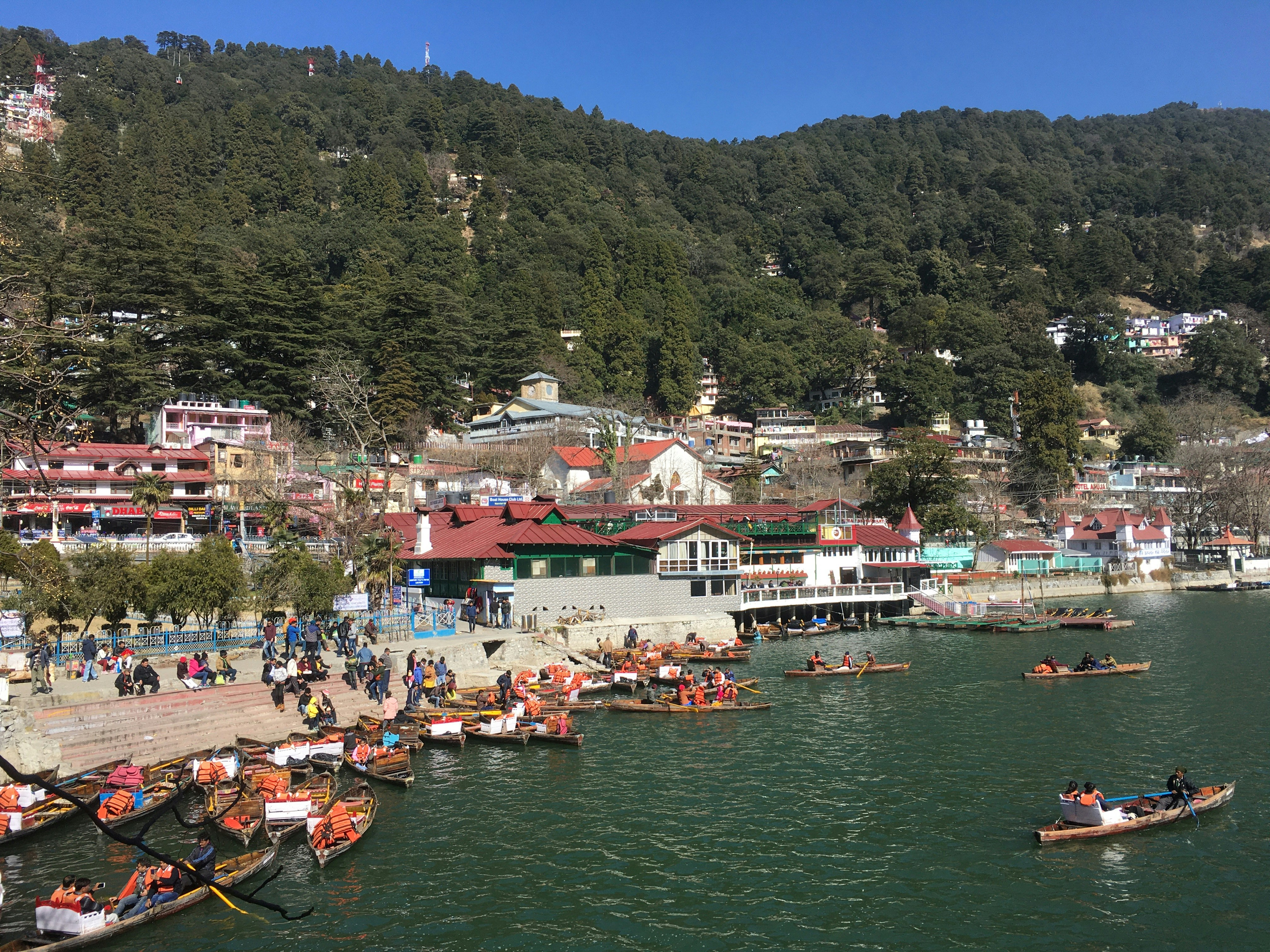 a group of people in small boats on a body of water