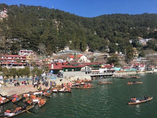 a group of people in small boats on a body of water