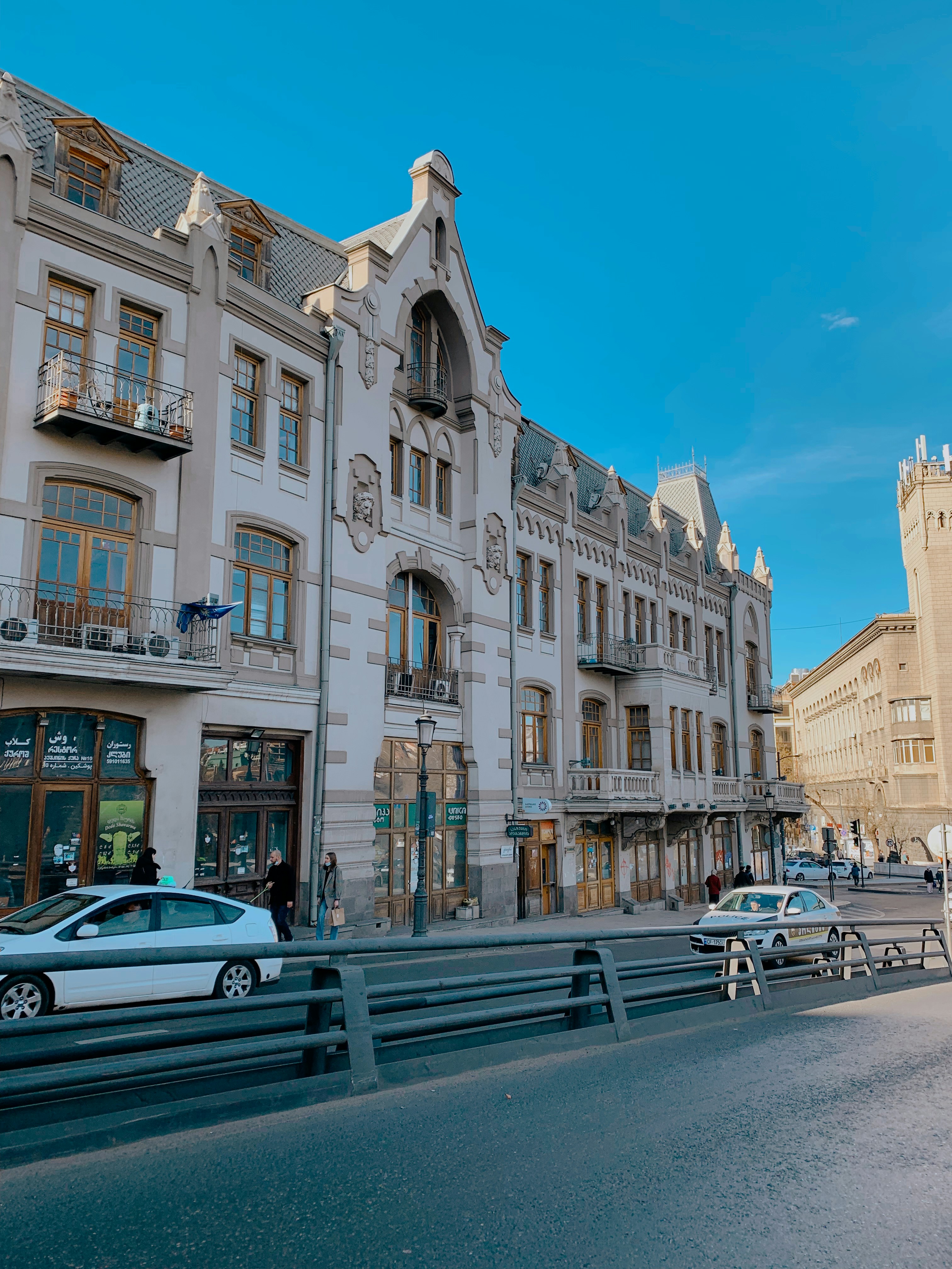 a row of buildings on a city street