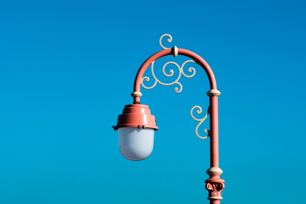 a street light with a blue sky in the background