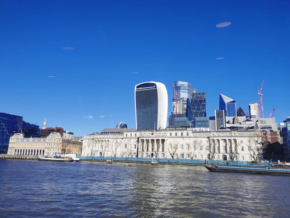 a large body of water with a city in the background