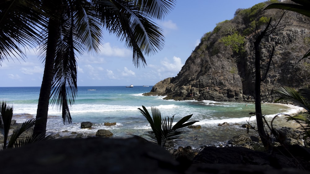 a view of the ocean from a rocky cliff