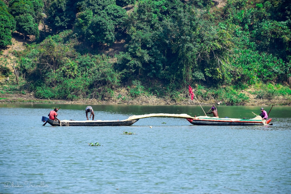 a group of people riding on the back of a boat