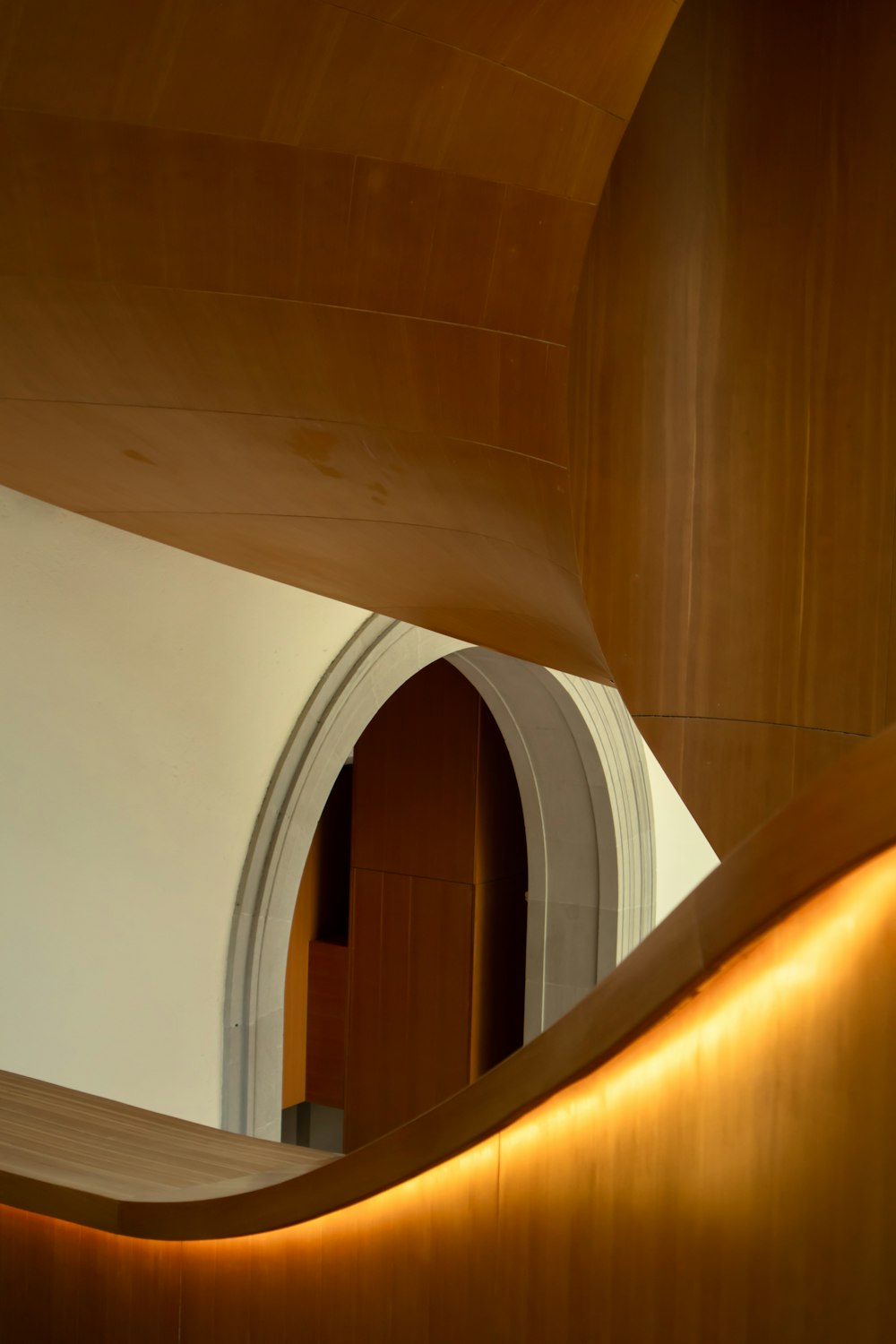 a curved wooden wall in a building