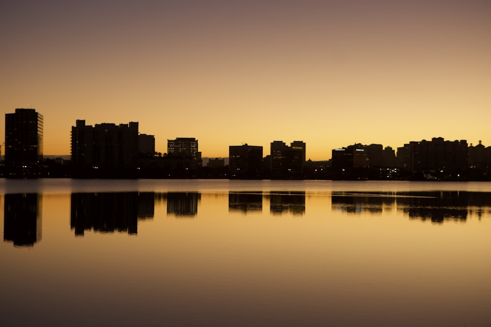 a large body of water with a city in the background