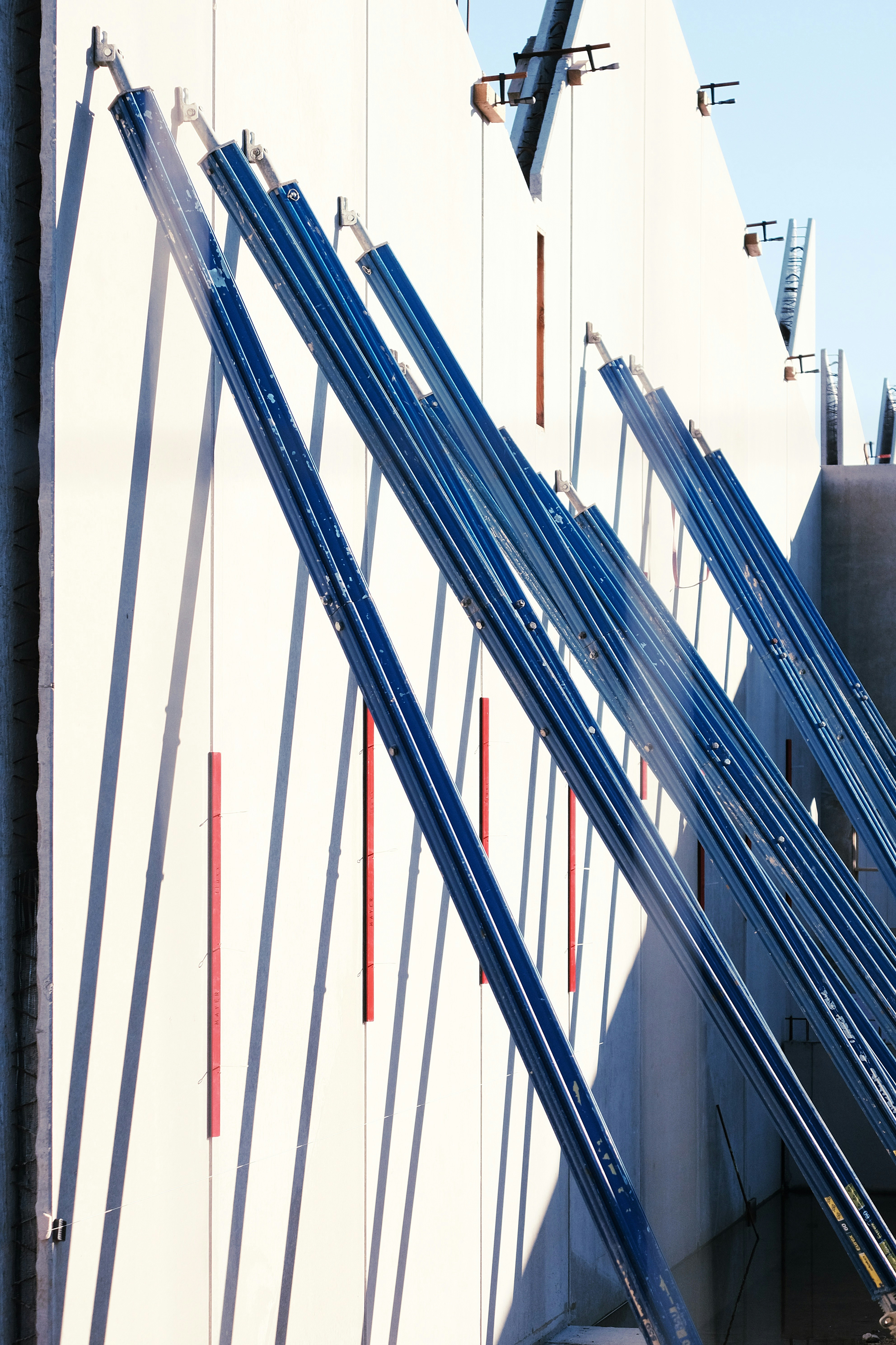 a building with a bunch of metal bars on the side of it