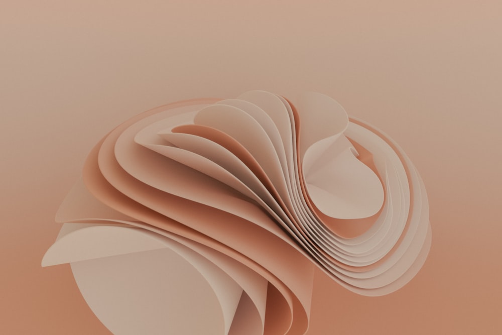 a close up of a paper sculpture on a pink background