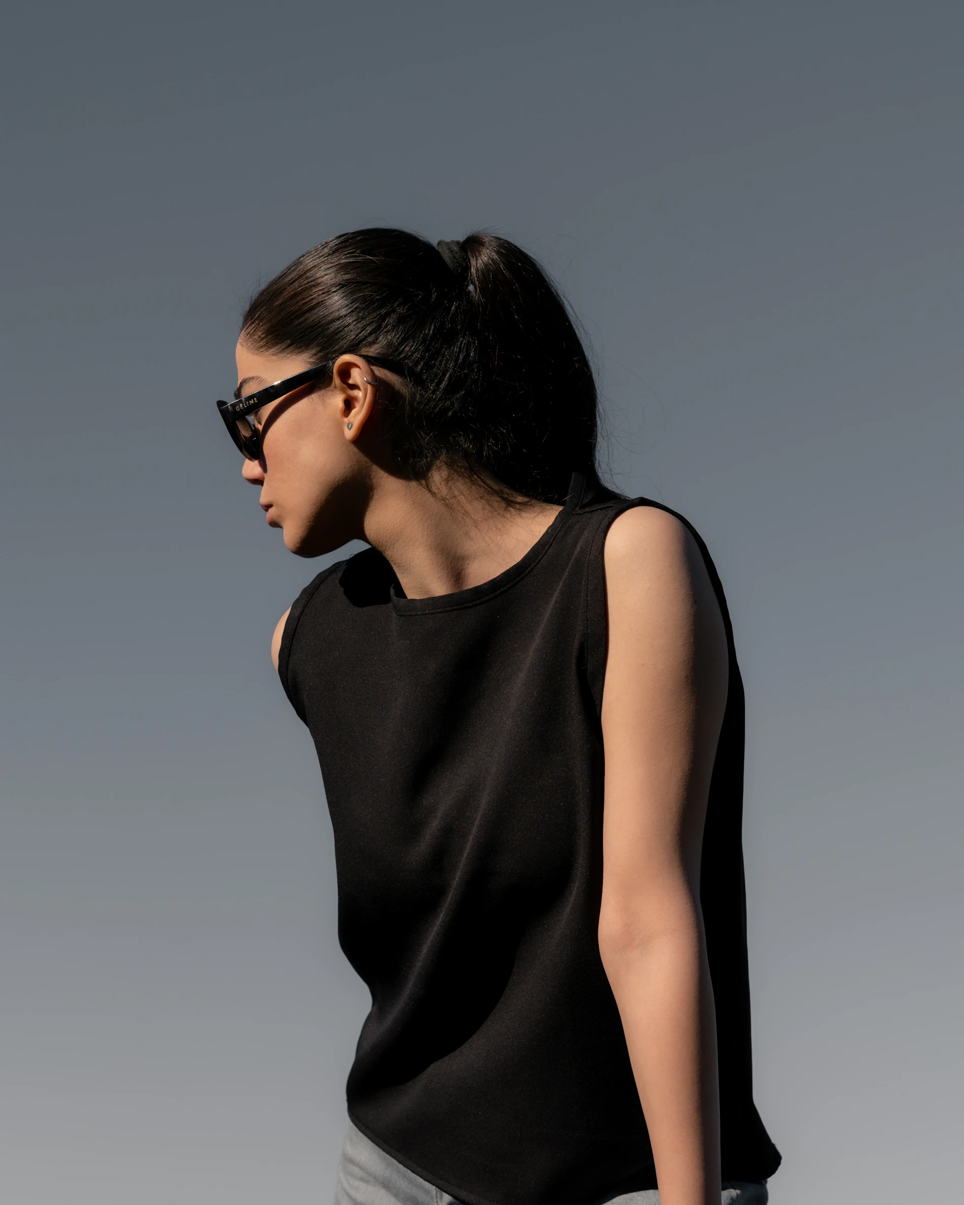 Woman wearing a modern black fashion outfit
