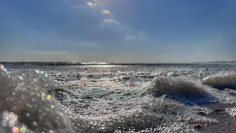 Surf breaking on the sands at Beadnell Bay