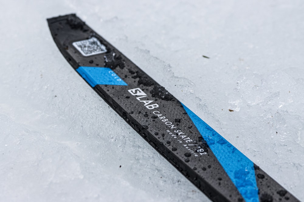 a close up of a snow ski on a snowy surface