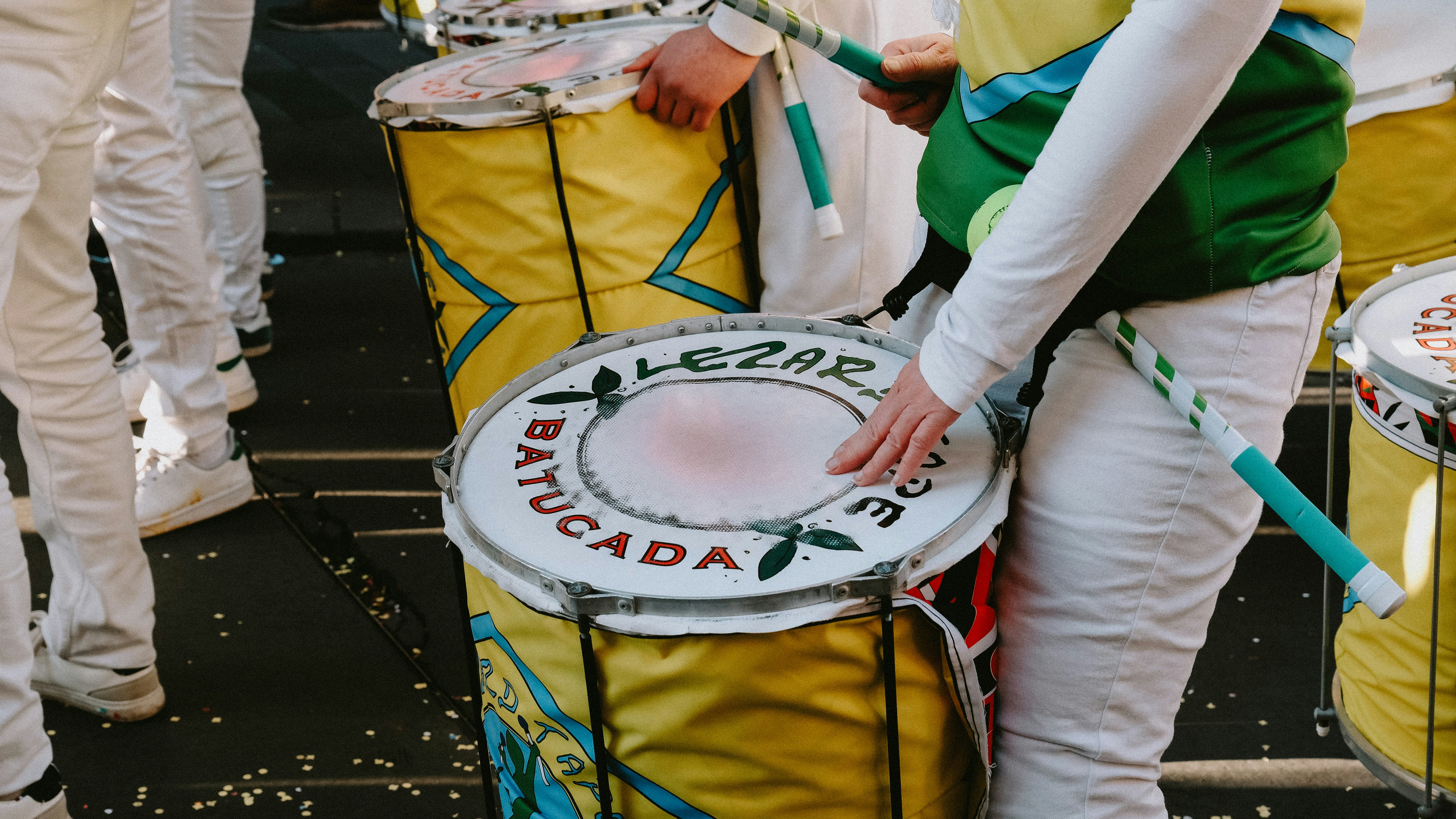 a person playing a drum in a parade