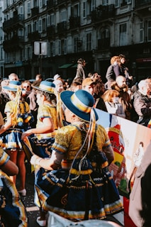 a group of people standing around each other in front of a crowd