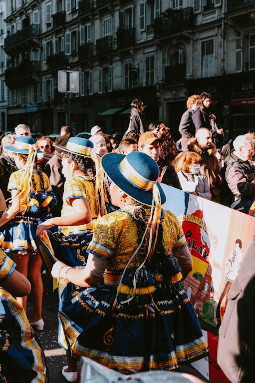 a group of people standing around each other in front of a crowd