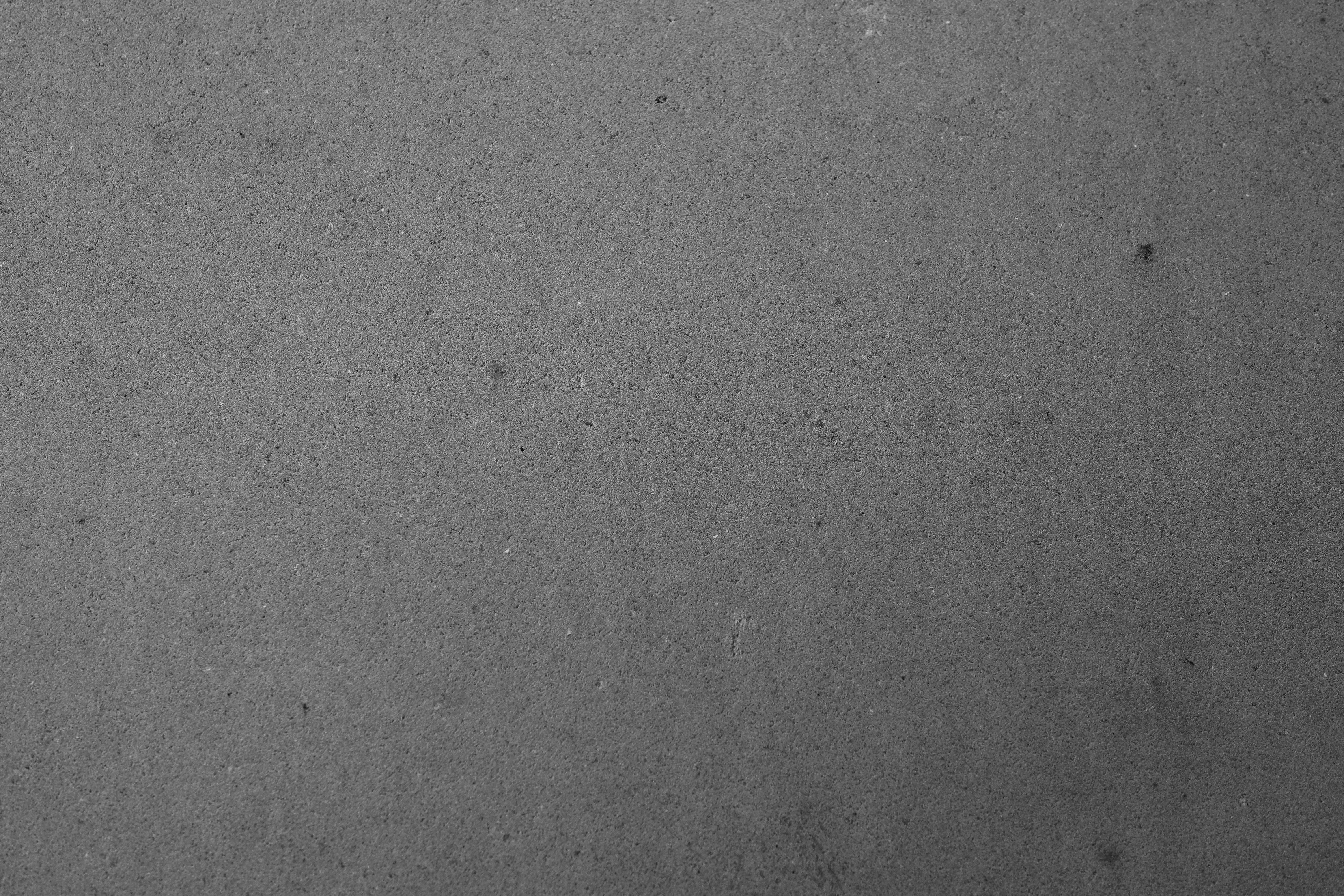 a black and white photo of a clock on a wall