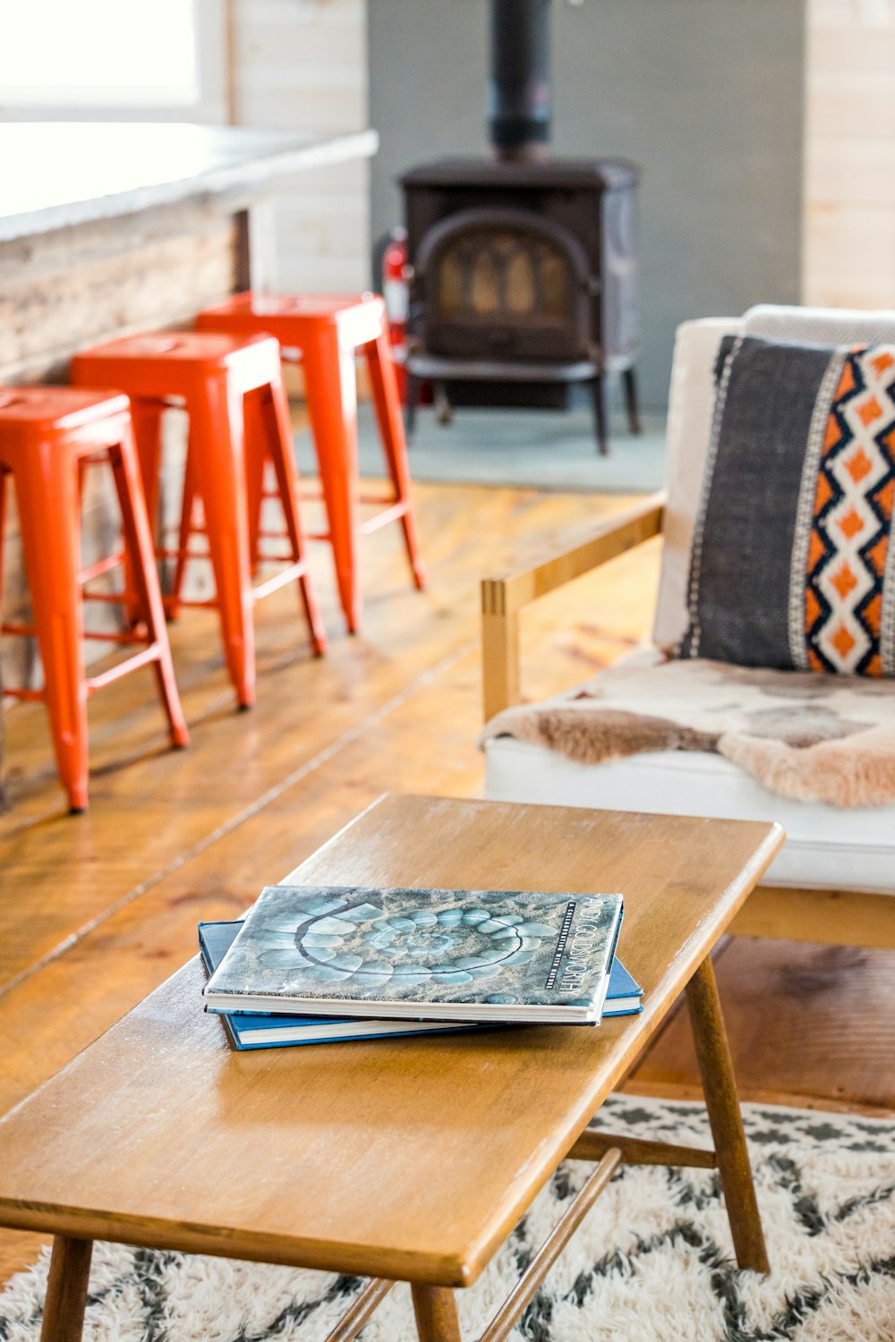 a living room filled with furniture and a fire place