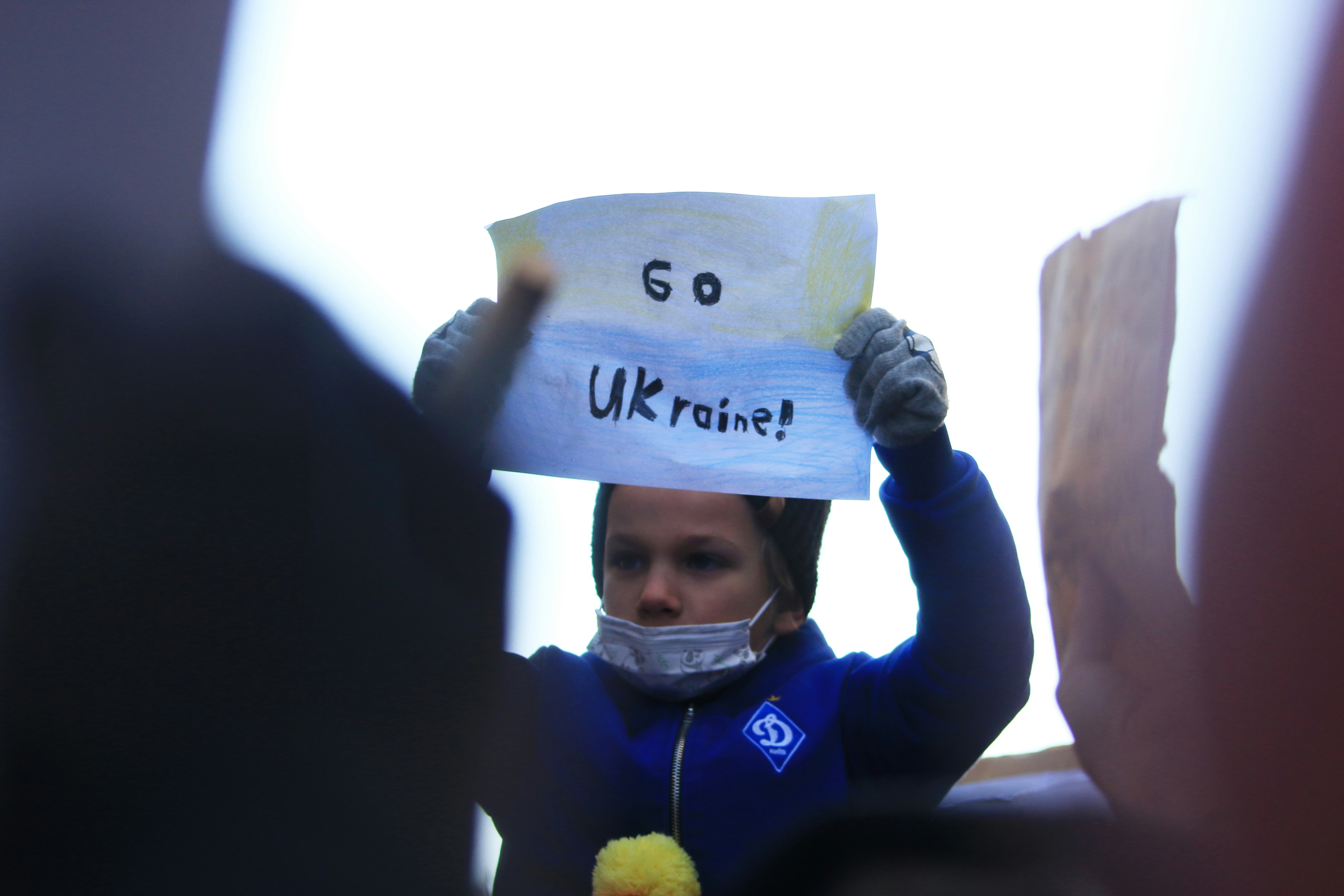 Sunday, February 27, 2022, Protesters gathered outside of Russian Consulate in uptown New York City to protest Russian's invasion in Ukraine. A child holding a sign reads "go Ukrain".