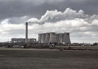 a factory with smoke coming out of it's stacks