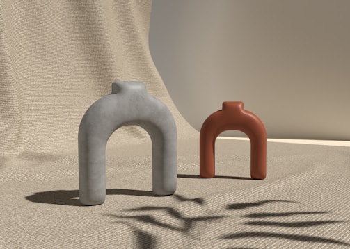 a couple of vases sitting on top of a carpet