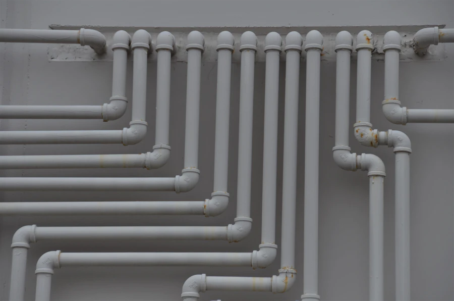 Close up of plumbing pipes and fittings on a wall