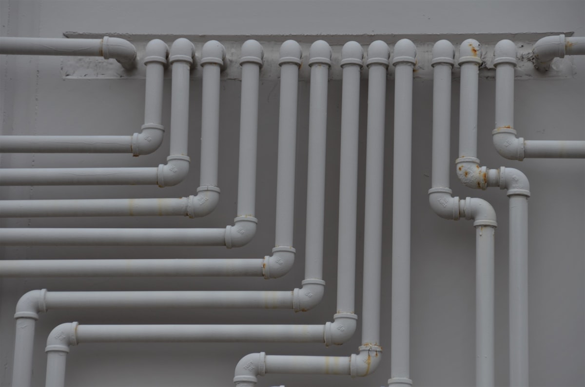 Runs of new piping on a wall