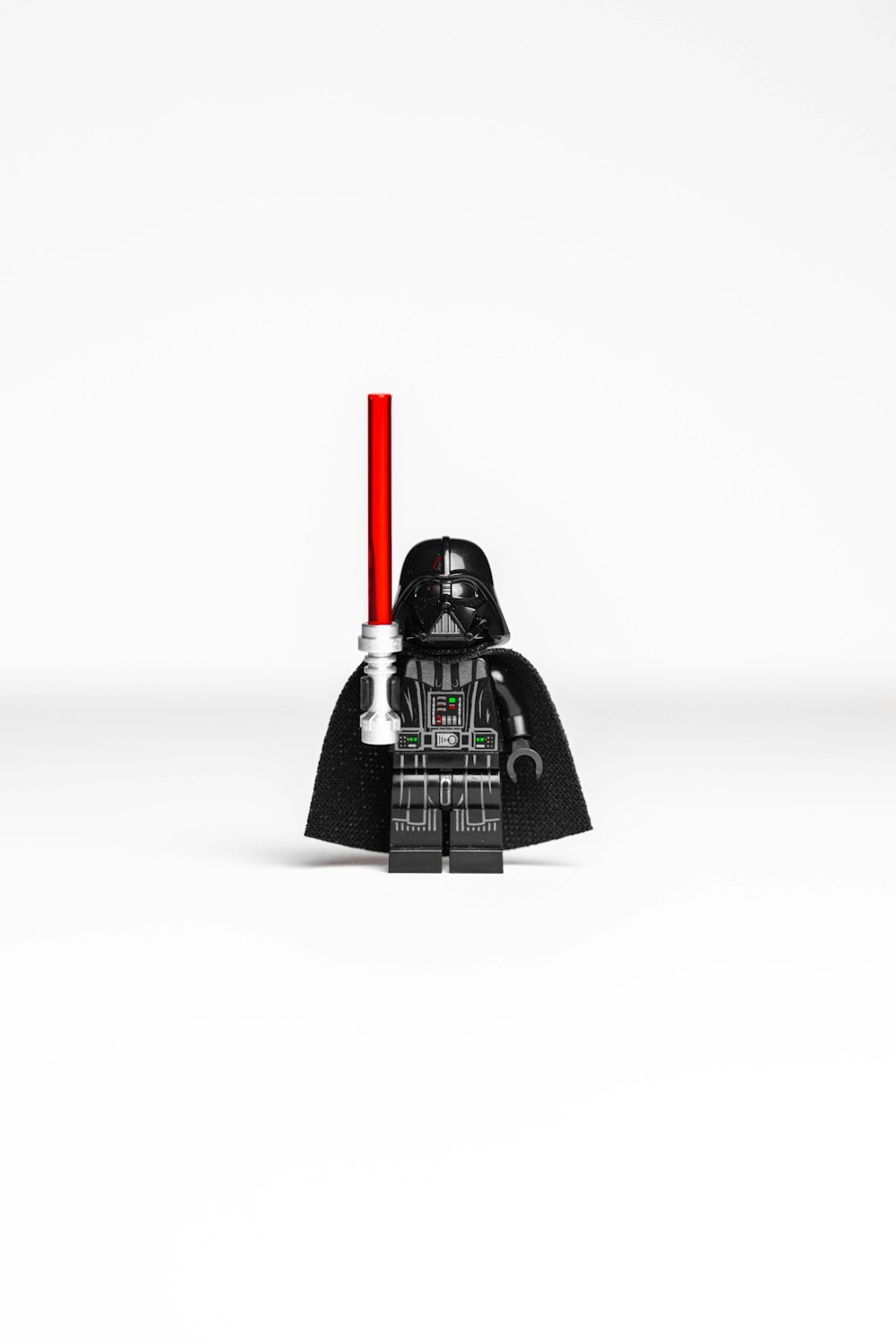 a lego darth vader with a red light on