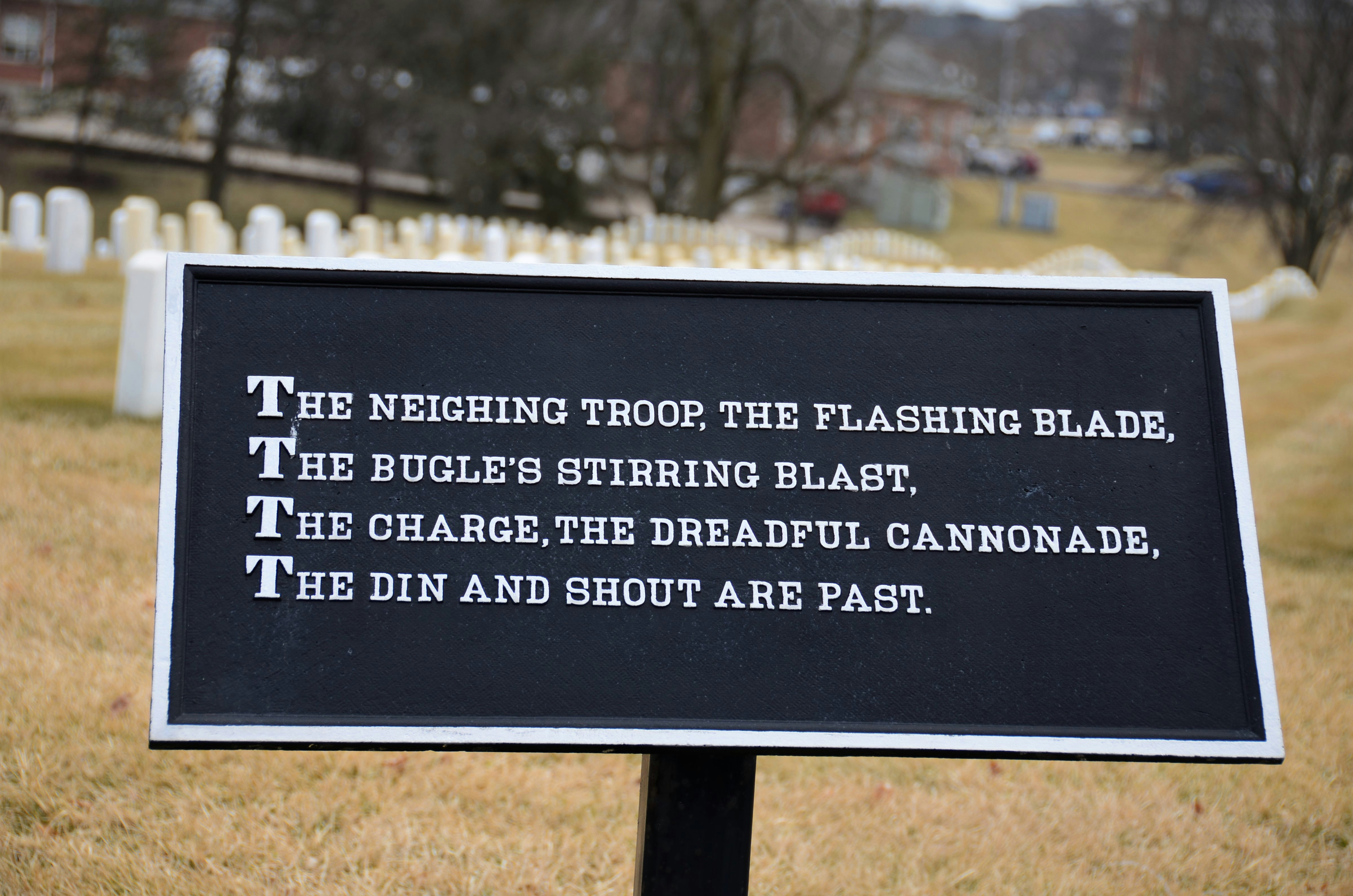 a black sign with a poem on it in a cemetery (Photo by Roger Starnes Sr on Unsplash)