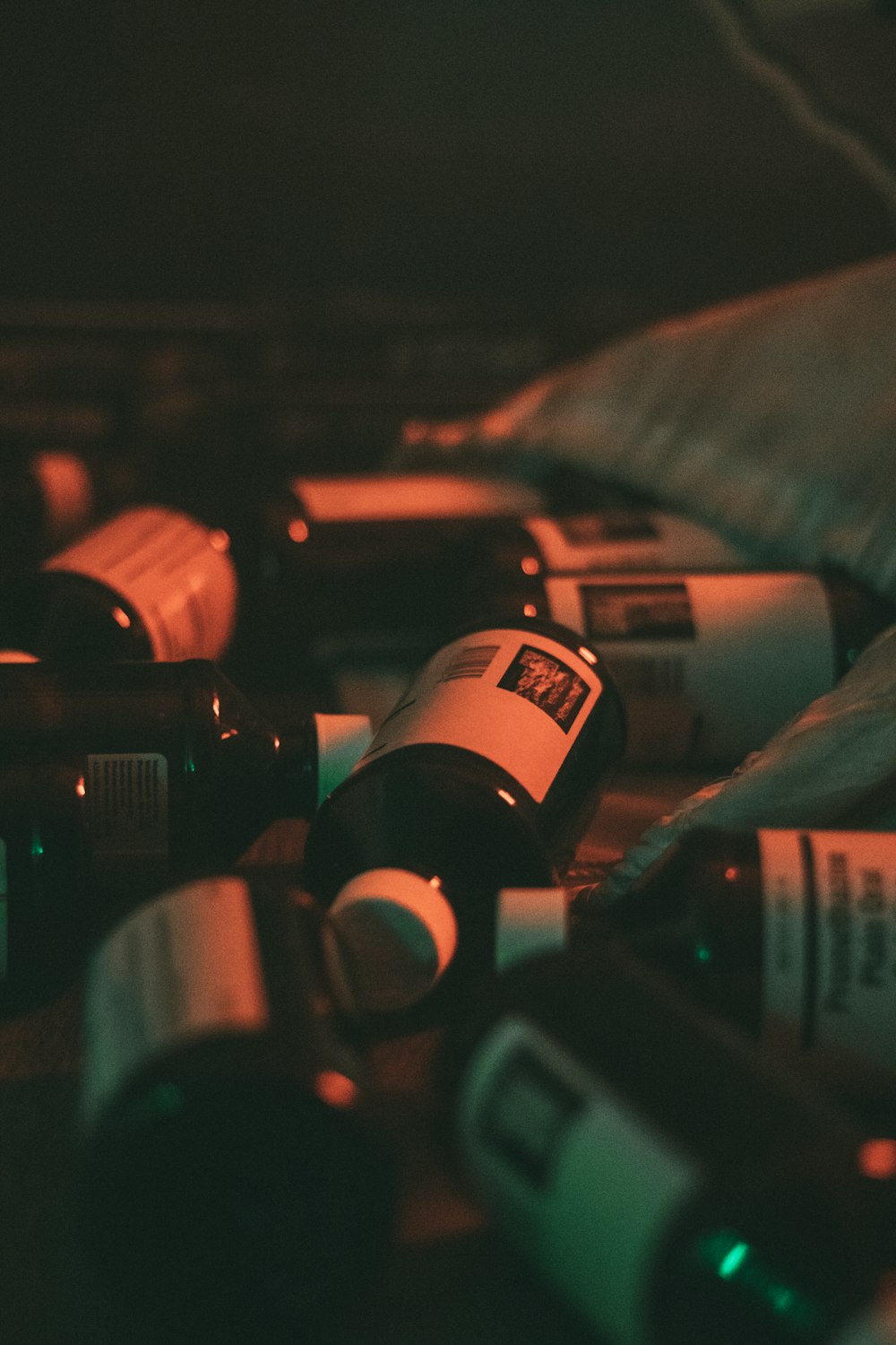 a bunch of wine bottles sitting on top of a table