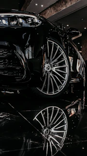 a black sports car parked in a showroom