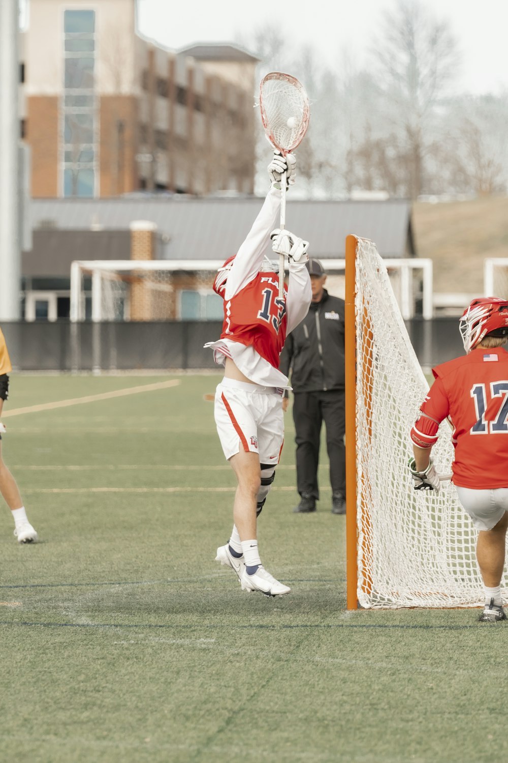 a group of men playing a game of lacrosse