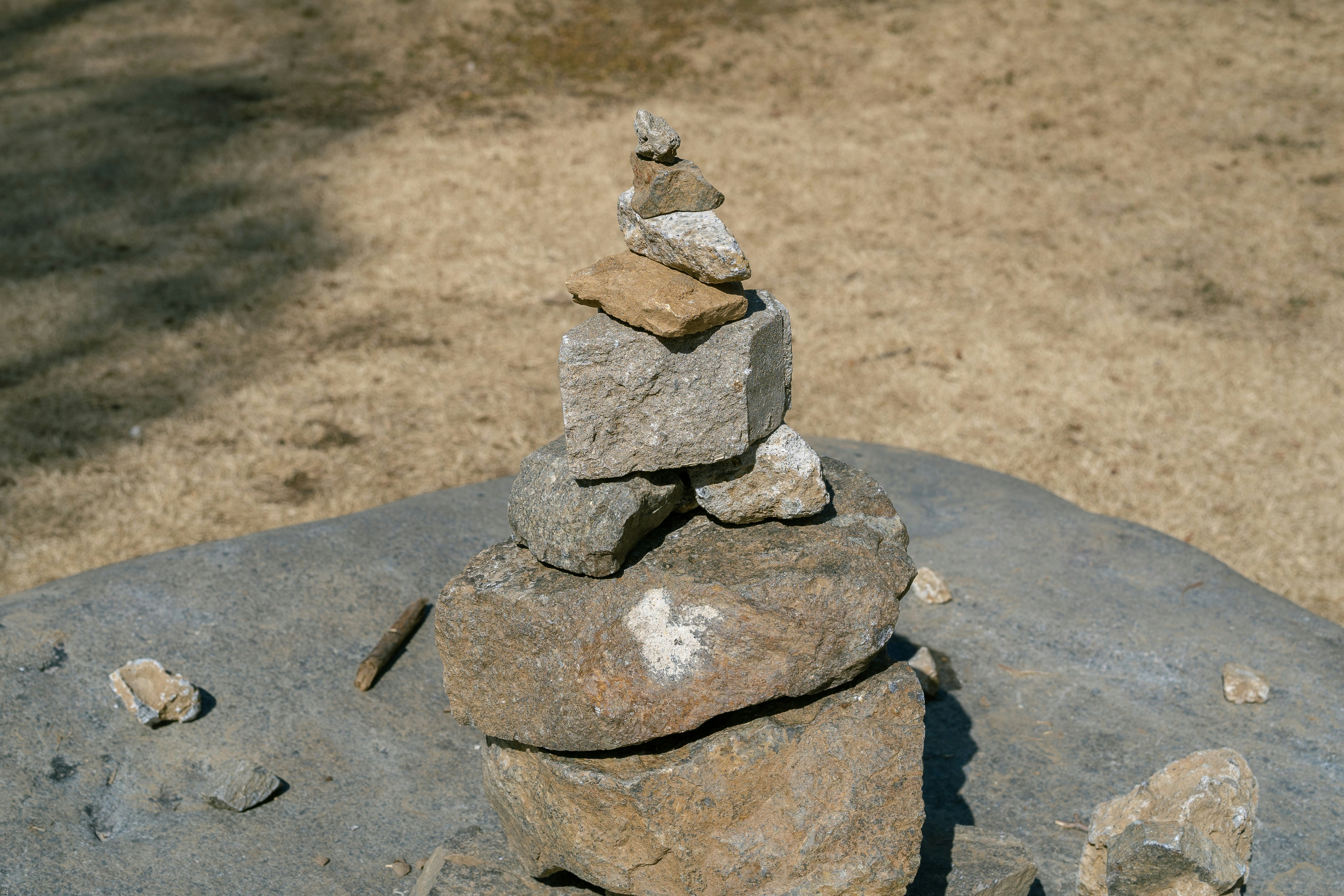 a stack of rocks sitting on top of a rock