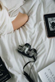 Artistic shot of a vintage camera beside a tablet displaying a digital magazine.
