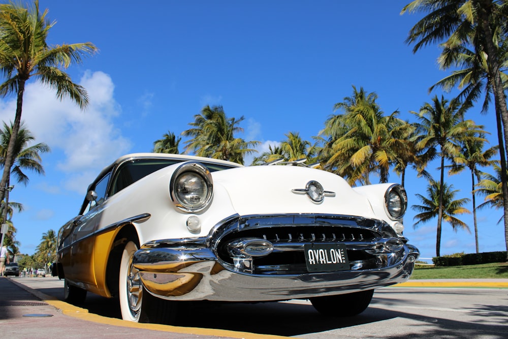 a classic car parked on the side of the road